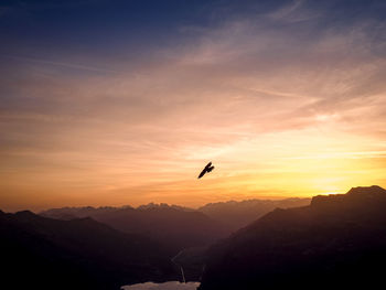 Scenic view of mountains against sky during sunset