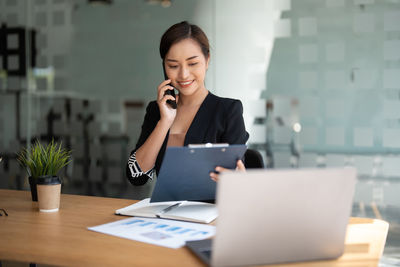 Businesswoman talking on smart phone