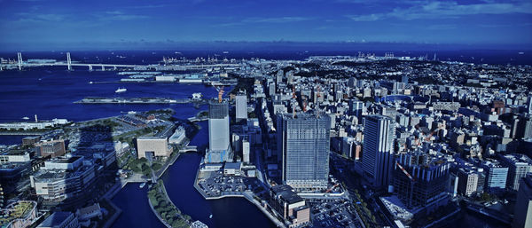 High angle view of city buildings against sky