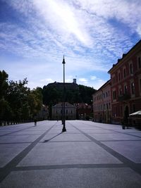 Street in city against sky