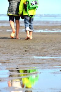 Low section of people on beach