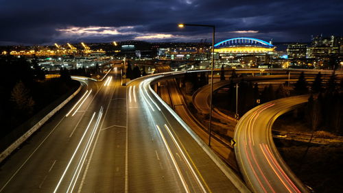 High angle view of light trails on highway at night