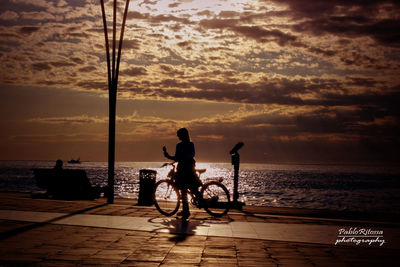 Woman looking at sea against cloudy sky