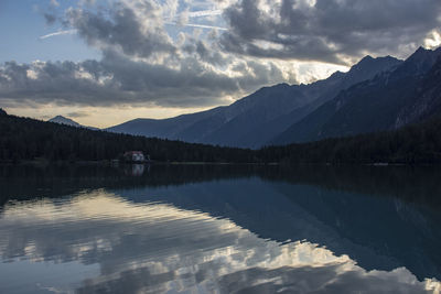 Scenic view of lake and mountains against sky