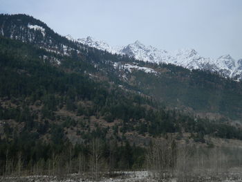 Scenic view of mountains against sky during winter