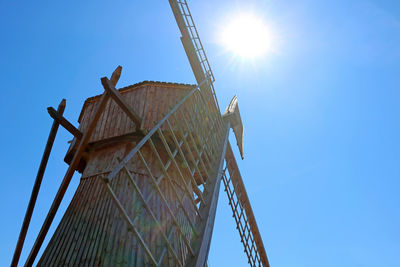 Low angle view of metallic structure against clear blue sky