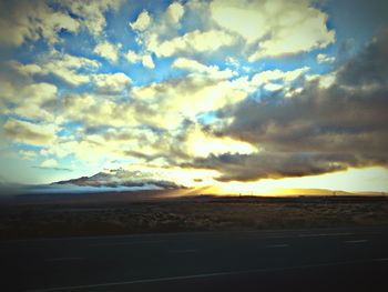 Scenic view of landscape against cloudy sky