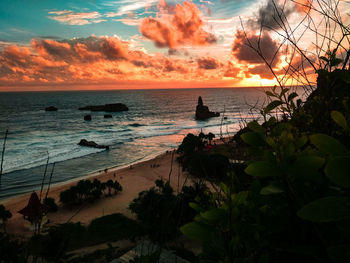 Scenic view of sea against cloudy sky