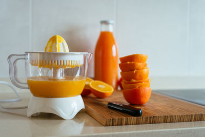 Close-up of orange juice in glass on table