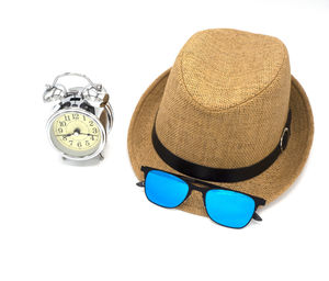High angle view of sunglasses on paper over white background