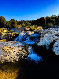 Scenic view of river against sky