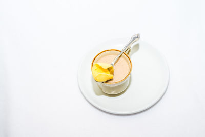 Close-up of coffee cup over white background