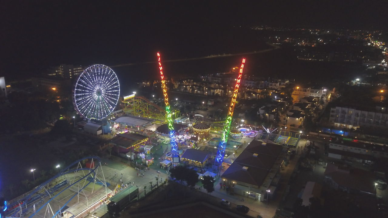 HIGH ANGLE VIEW OF ILLUMINATED CITY