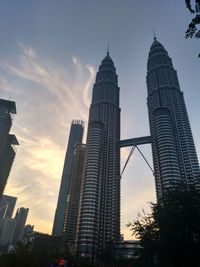 Low angle view of buildings against sky during sunset