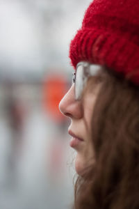 Close-up portrait of woman wearing hat