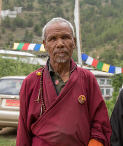 Portrait of man standing outdoors