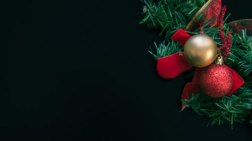 Christmas decorations over black background