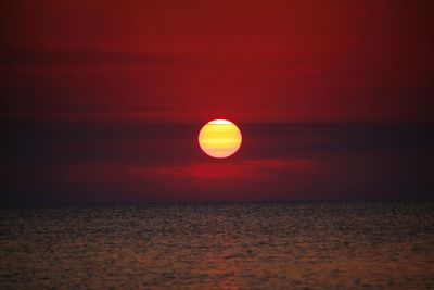 Scenic view of sea against romantic sky at sunset