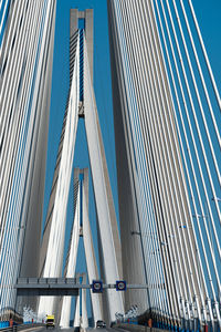Low angle view of modern bridge against sky
