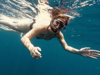 Woman swimming in sea