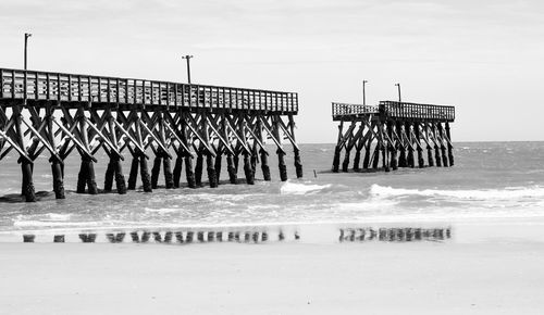 Pier over sea against sky