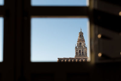 Low angle view of clock tower against sky