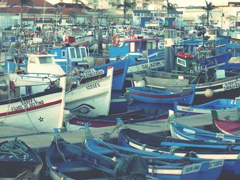 Boats moored at harbor