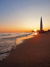 Scenic view of sea against clear sky during sunset