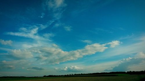 Scenic view of landscape against cloudy sky