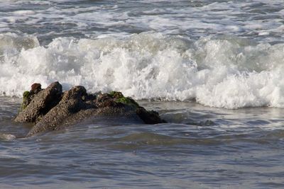 Waves splashing on rocks