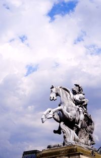 Low angle view of statue against sky