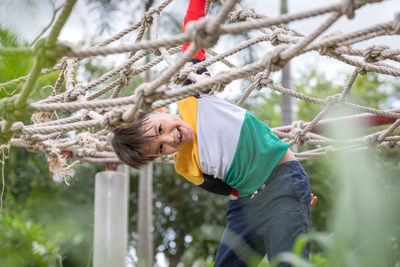 Portrait of boy playing in playground