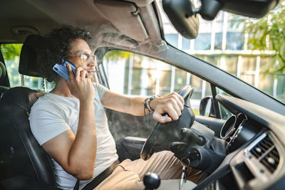 Young woman driving car