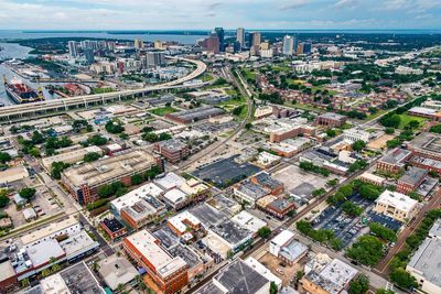 High angle view of illuminated city buildings against sky