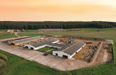 High angle view of agricultural field against sky during sunset