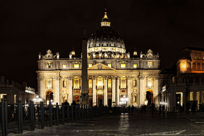 Illuminated church against sky at night