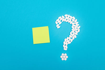 Directly above shot of heart shapes on blue background