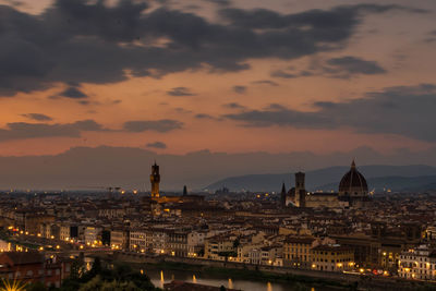 High angle view of illuminated buildings against sky during sunset