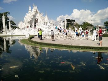 Panoramic view of people in park against sky