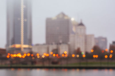 Close-up of illuminated cityscape against clear sky