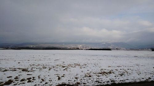 Scenic view of frozen sea against sky