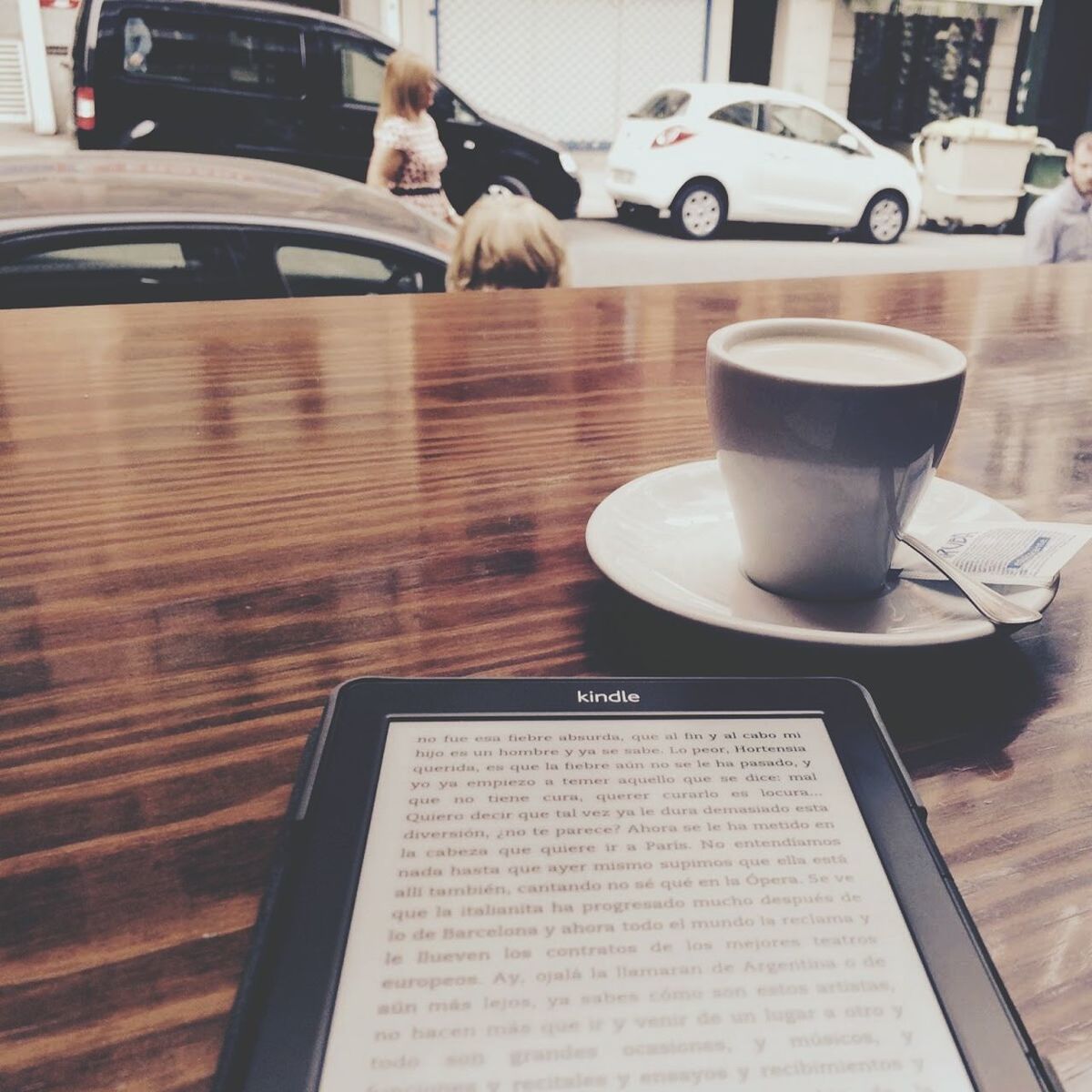 indoors, table, coffee cup, food and drink, drink, coffee - drink, refreshment, still life, book, close-up, communication, cafe, restaurant, chair, coffee, reflection, cup, saucer, day, high angle view