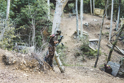 High angle view of army soldiers training in forest