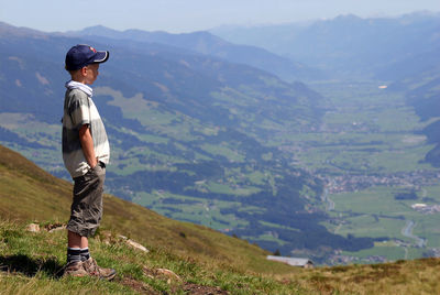Full length of boy against mountain range