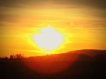 Scenic view of landscape at sunset