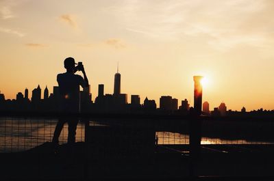 Silhouette of building at sunset