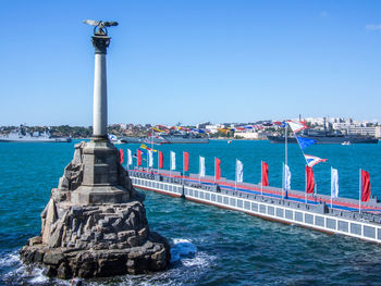 View of sea against clear blue sky