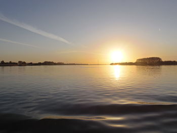 Scenic view of sunset over river