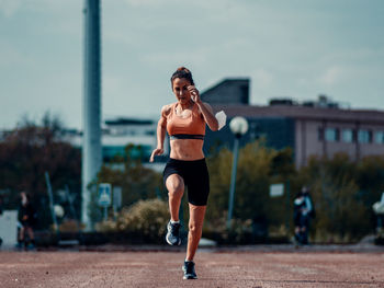 Full length of man running on road