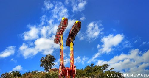 Low angle view of ferris wheel against sky